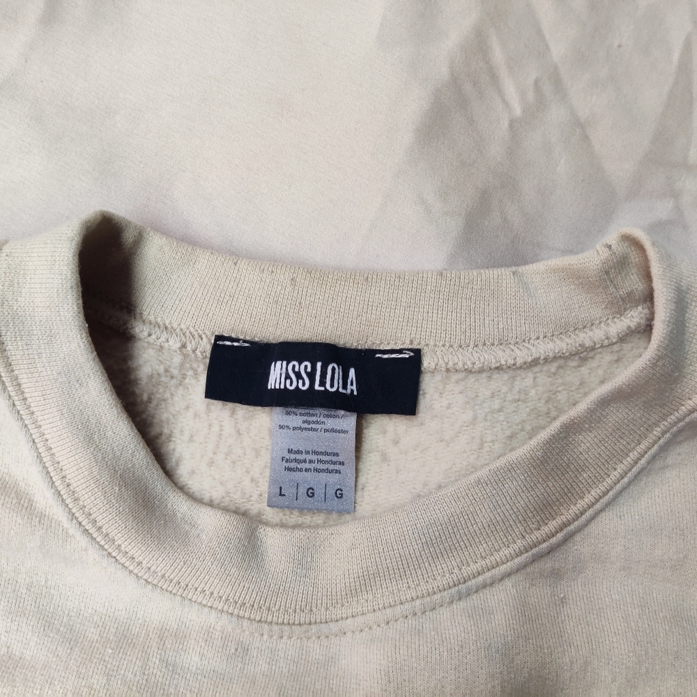 Miss Lola off Cream sweater